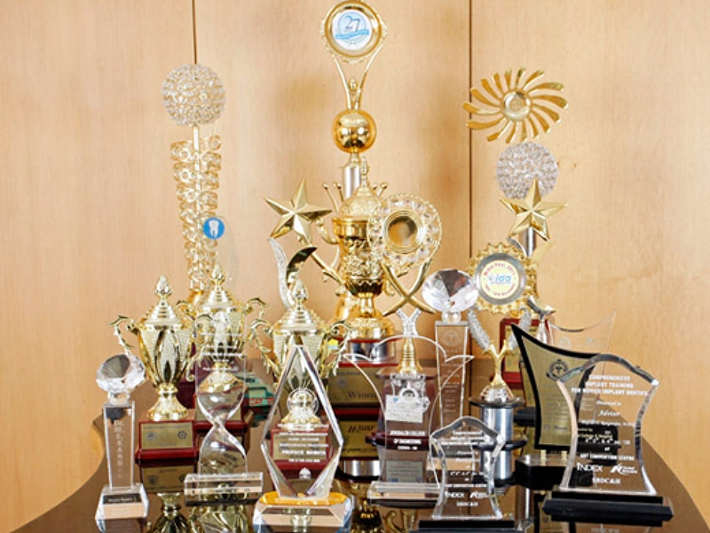 a group of trophies on a table